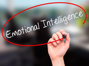 Man Hand writing Emotional Intelligence with black marker on visual screen. Business, technology, internet concept.