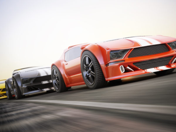 The race , Exotic sports cars racing with motion blur . Generic