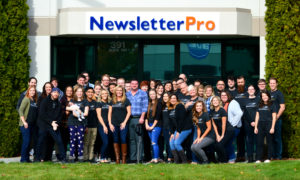 Team ribbon cutting at Newsletter Pro in Boise