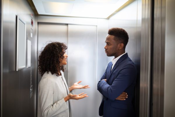 Young African Businesspeople Having Conversation In Elevator, elevator pitch