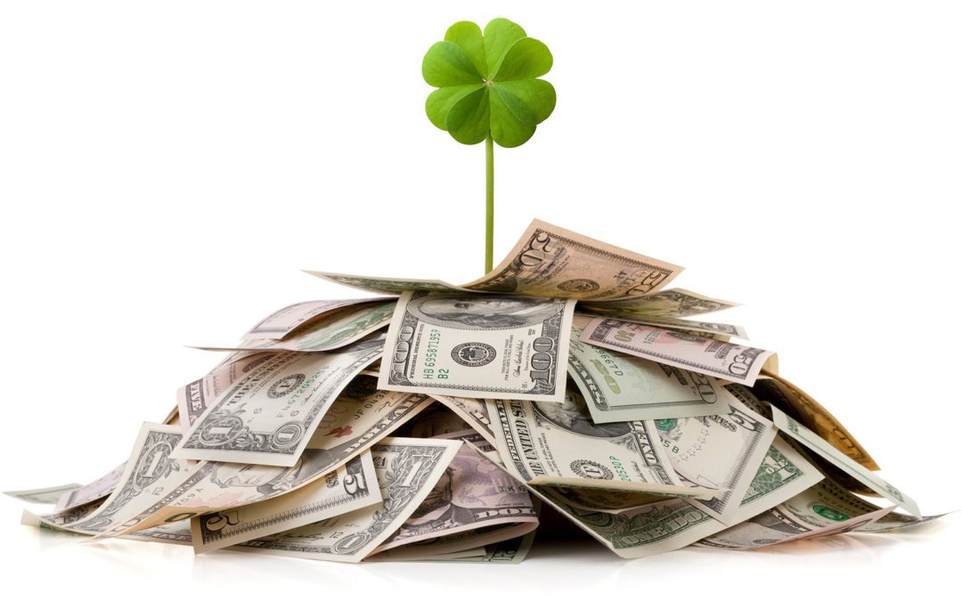 lucky clover growing from money