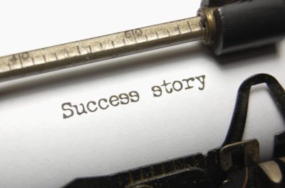 The typed words Success Story on an old typewriter
