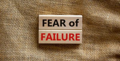 Fear of failure symbol. Wooden blocks with words 'fear of failure'. Beautiful canvas background, copy space. Business, fear of failure concept.