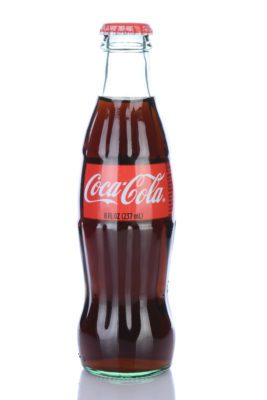IRVINE CA - January 29 2014: An 8 ounce bottle of Coca-Cola Classic. Coca-Cola is the one of the worlds favorite carbonated beverages.
